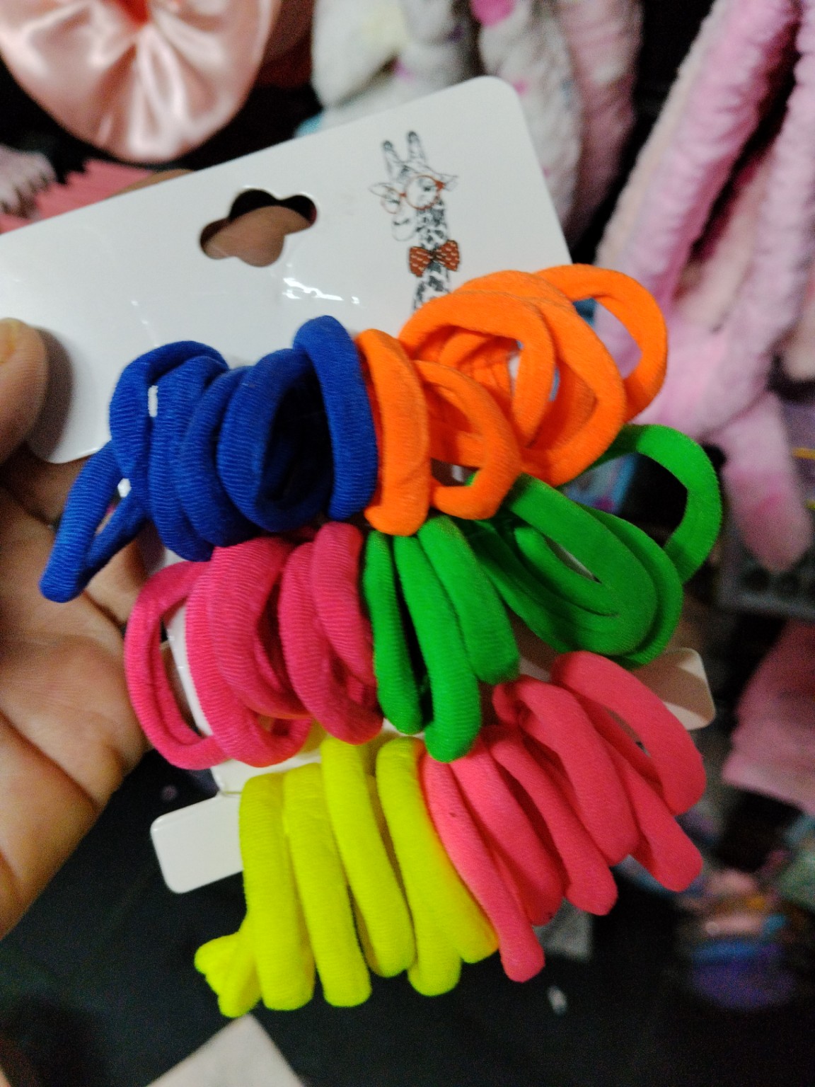 Foto de Cartela de elásticos coloridos para cabelo
