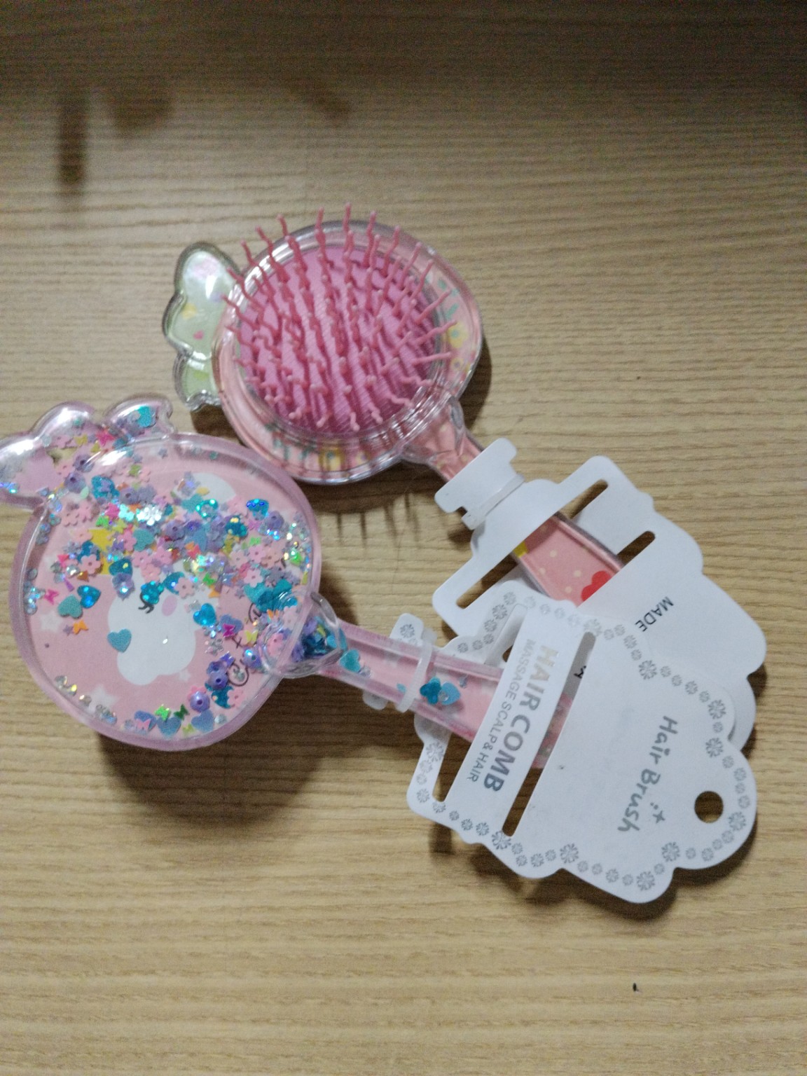 Foto de Escova de cabelo infantil com pente e glitter decorativo